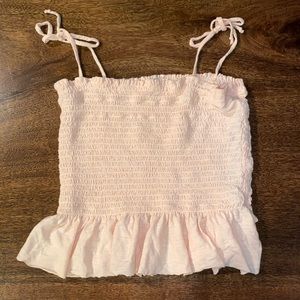 peach tie strap tank top with ruffle at bottom